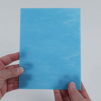 Video of the Pale Opal Turquoise glass plate in translucent turquoise, 15x19cm, held up and tilted to show its pattern and transparency