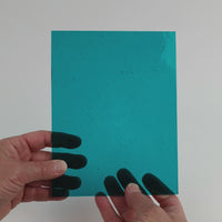 Video of the Steel Blue glass plate in transparent teal, 15x19cm, held up and tilted to show its pattern and transparency