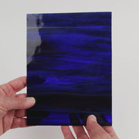 Video of the Mystic glass plate in translucent Red-Violet-Blue, 15x19cm, held up and tilted to show its pattern and transparency