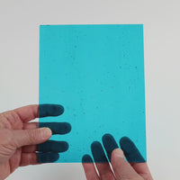 Video of the Clear Water glass plate in transparent blue, 15x19cm, held up and tilted to show its pattern and transparency