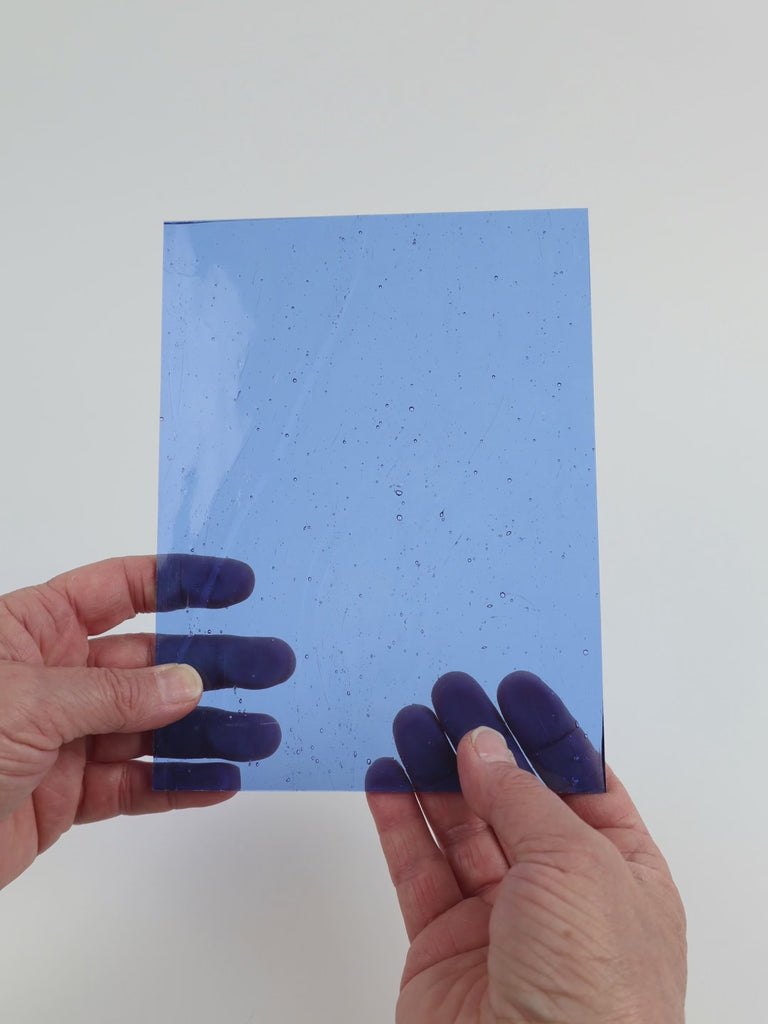 Video of the Sky Blue glass plate in transparent blue, 15x19cm, held up and tilted to show its pattern and transparency